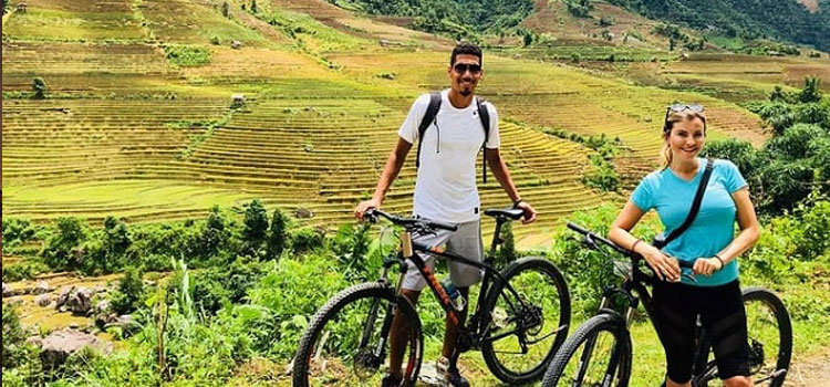 Riding bicycle around village of Sapa to admire its breathtaking beauty