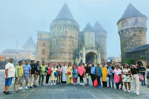 Indian tourists take photos in the French village during their visit to Ba Na Hills.