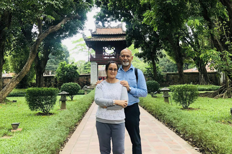 Happy Indian tourists in Temple of Literature in Hanoi
